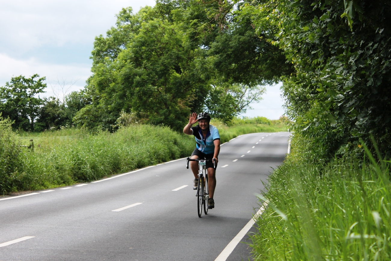 Cyclist, waving, sportive, pic: Colin Henrys/Factory Media
